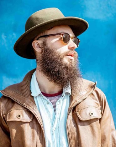 portrait-of-a-stylish-man-on-the-colorful-backgrou-ZXGKRV2.jpg